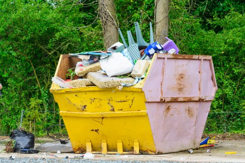 Operatives handling a house clearance job paperwork on a truck